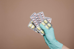 Close-up of person holding medicines